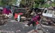 Aruna, 48, who loses everything in the fire, leaves for work early in the morning in Karai...