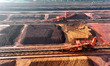 Large machinery piles up and unloads iron ore at the Xinsu Port Terminal in Lianyungang, J...