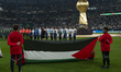 Starting players of Palestine line up prior to the Group B FIFA Arab Cup 2025 match betwee...