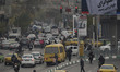 Vehicles drive along an avenue during heavy air pollution in downtown Tehran, Iran, on Dec...