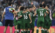 Players of Syria celebrate after qualifying for the knockout stage after the Group A FIFA...