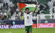 Mahmoud Alaswad of Syria celebrates after qualifying for the knockout stage following the...