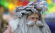 Jose Miguel Moctezuma, a street artist, human statue, and makeup artist, dresses as Santa...