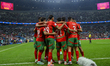 Players of Morocco celebrate after scoring a goal during the Group B FIFA Arab Cup 2025 ma...