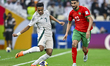 Walid El Karti of Morocco and Musab Aljuwayr of Saudi Arabia are in action during the Grou...