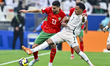 Walid El Karti of Morocco and Musab Aljuwayr of Saudi Arabia are in action during the Grou...