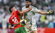 Amin Zahzouk of Morocco and Waleed Alahmad of Saudi Arabia play during the Group B FIFA Ar...