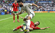 Karim El Berkaoui of Morocco and Nawaf Bu Washl of Saudi Arabia are in action during the G...