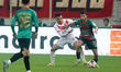 Billel Boukerchaoui of CR Belouizdad battles for the ball with Oussama Benhaoua of MC Alge...