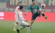 DJABER KAASSIS of CR Belouizdad competes for the ball with OUSSAMA BENHAOUA of MC Alger du...