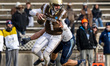 Hayden Johnson of the Lehigh Mountain Hawks evades pressure from Shane Hartzell of the Vil...
