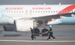 Rescue personnel transport injured passengers on a ''distressed passenger plane'' during t...