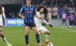 Charles De Ketelaere of Atalanta BC battles for the ball with Marc Cucurella of Chelsea FC...