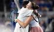 DJ Irie of the USA hugs Amanda Anisimova of the USA during the Miami Invitational at loanD...
