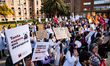 Hundreds of doctors from the public and private healthcare systems demonstrate under the s...