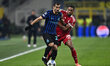Henrikh Mkhitaryan of F.C. Inter and Ryan Gravenberch of Liverpool F.C. are in action duri...
