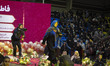 Iranian woman, Fatemeh Rezaie, walks to the stage as she is introduced as Iran's 1404 Lady...
