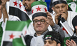 Fans of Syria cheer ahead of the FIFA Arab Cup 2025 Quarter-final match between Morocco an...