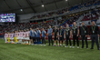 Jose Lana, the head coach of Syria, his staff, and substitutes line up prior to the FIFA A...