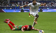 Mohamed Boulacsout of Morocco and Mahmoud Alaswad of Syria are in action during the FIFA A...