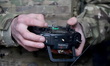 An operator who goes by the call sign ''Hrei'' holds a remote control unit of a new Ukrain...