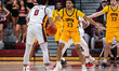 DAVEYON LYDNER (23) of the Coppin State Eagles plays defense against DEREK SIMPSON (0) of...