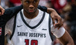 Jaden Smith (10) of the St. Joseph's Hawks stands during a timeout in an NCAA men's basket...