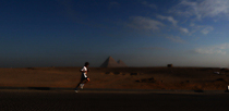 Editorial photo: One of the participants in the Pyramids Half Marathon in Giza, Egypt, on December 13, 2025  by Ahmed Mosaad/NurPhoto