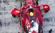 Top down image of Lewis Hamilton of Great Britain in the pit surrounded by mechanics and e...