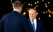 German Chancellor Friedrich Merz greets Polish Prime Minister Donald Tusk upon his arrival...