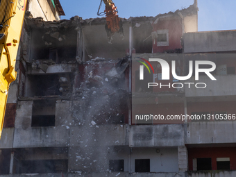 The demolition machines strike the first blows to Scampia's Vela Rossa in Naples, Italy, on Wednesday morning. This marks the beginning of t... by Paolo Manzo/NurPhoto