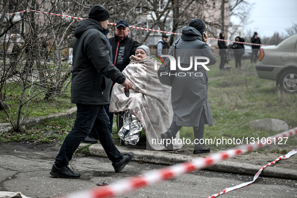 An elderly woman, evacuated from an apartment block hit by a Russian guided aerial bomb, is wrapped in a blanket in Zaporizhzhia, Ukraine, o... by Dmytro Smolienko/Ukrinform/NurPhoto