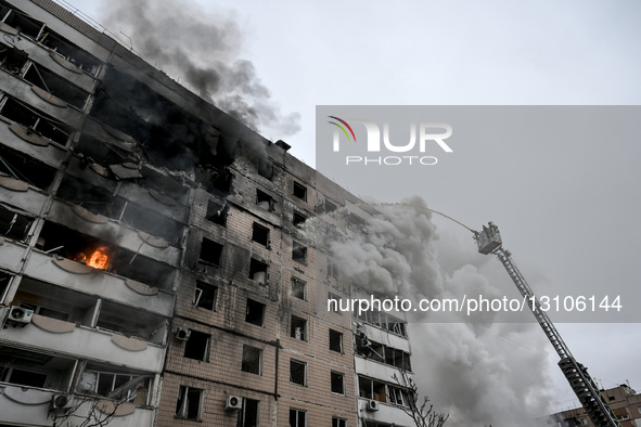 A firefighter uses an aerial ladder to suppress a fire in an apartment block hit by a Russian guided aerial bomb in Zaporizhzhia, Ukraine, o... by Dmytro Smolienko/Ukrinform/NurPhoto