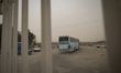 A bus carrying Afghan refugees leaves the Milak refugee camp as it departs for Afghanistan...