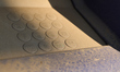 A close-up view shows a dusty and worn numerical keypad of a self-service payment terminal...