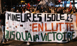 Protesters hold a banner that reads ''Isolated minors fighting until victory'' during a pr...
