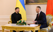 Polish President Karol Nawrocki welcomes Ukraine's President Volodymyr Zelenskyy during a...