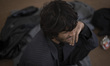 An Afghan refugee sits in the Alghadir Refugee Camp located in the suburb of the border ci...