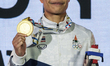 Chuthamat Raksat of Thailand poses on a podium during the medal ceremony for the Women's f...