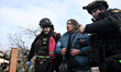 First responders assist a woman injured in Russian shelling in Zaporizhzhia, Ukraine, on D...