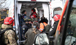A paramedic helps a woman affected by Russian shelling in an ambulance in Zaporizhzhia, Uk...