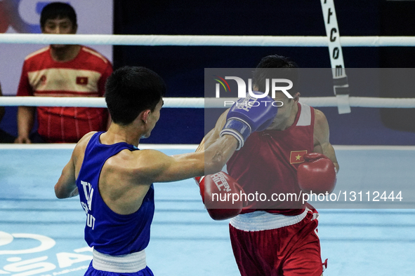 Sarawut Sukthet of Thailand competes against Nguyen Van Duong of Vietnam in the men's featherweight 57kg finals, the gold medal boxing match... by Anusak Laowilas/NurPhoto