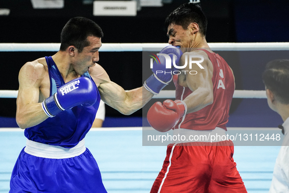 Sakda Ruamtham of Thailand competes against Asri Udin of Indonesia during the Men's lightweight 60kg finals - Gold medal boxing match in the... by Anusak Laowilas/NurPhoto