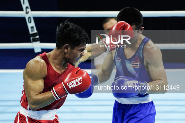 Sakda Ruamtham of Thailand competes against Asri Udin of Indonesia during the Men's lightweight 60kg finals - Gold medal boxing match in the... by Anusak Laowilas/NurPhoto