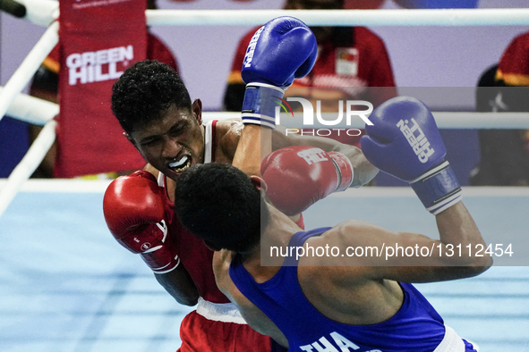 Khunatip Pidnuch of Thailand competes against Elisio Raimundo Gaio of Timor-Leste during the Men's light welterweight 63.5kg finals - Gold m... by Anusak Laowilas/NurPhoto
