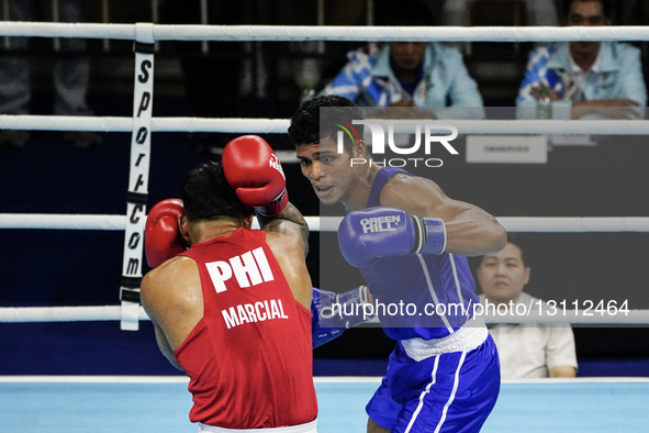 Eumir Felix Marcial of the Philippines competes against Maikhel Roberrd Muskita of Indonesia during the Men's light heavyweight 80kg finals... by Anusak Laowilas/NurPhoto