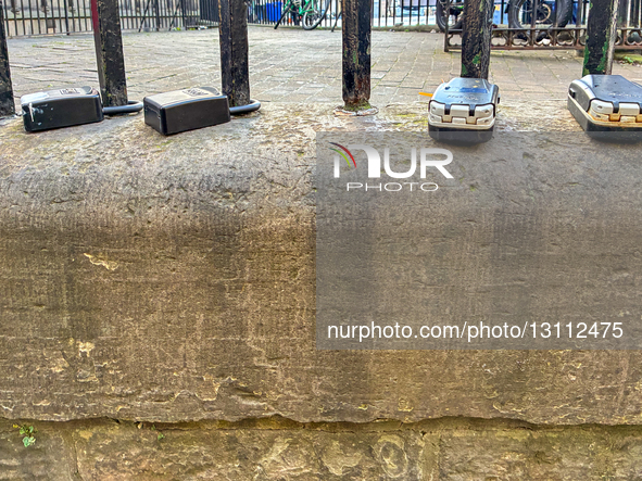 Multiple combination key boxes used for guest access to Airbnb, Booking.com, and other short-term rental apartments are attached to a street... by Michael Nguyen/NurPhoto