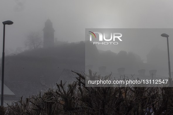 The sun shines above the Petrovaradin Fortress during fog in Novi Sad, Serbia, on December 9, 2023.  by Maxim Konankov/NurPhoto