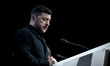 President of Ukraine Volodymyr Zelenskyy appears in dark background as he holds a press co...
