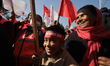 Child participants hold party flags during a unity message rally organized by the Nepali C...